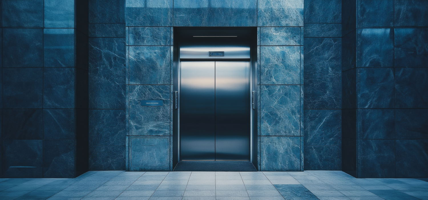 Modern Elevator Doors Installed in Urban Building Lobby During Evening Hours